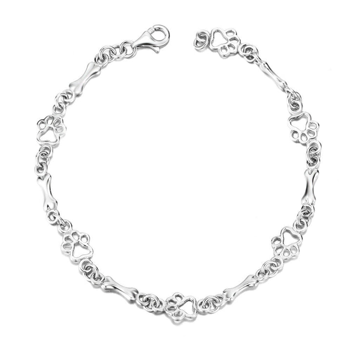 Pulseira com pendentes em forma de pata de cão e osso em prata