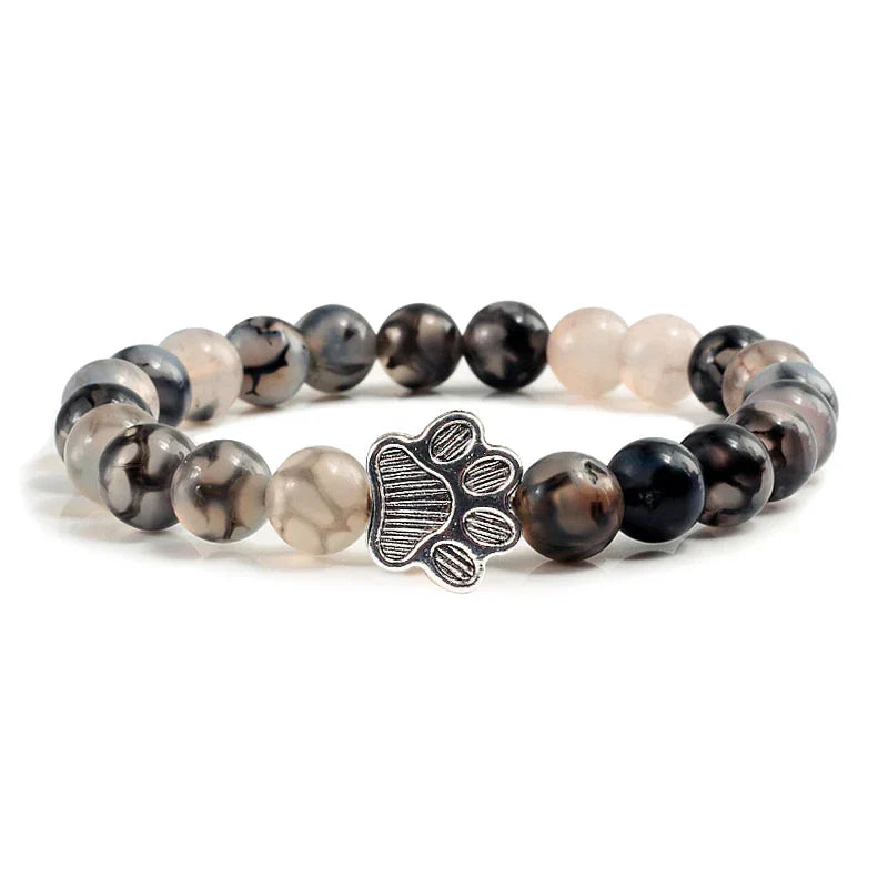 Bracelete com patas decoradas com pérolas