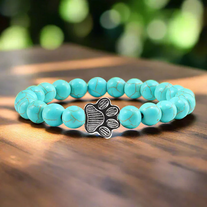 Bracelete com patas decoradas com pérolas